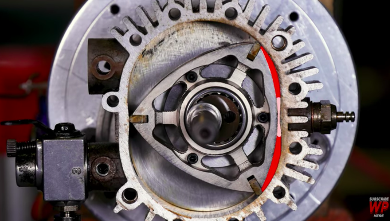 Illustration for article titled Watch A Wankel Rotary Engine’s Beautiful Explosions Through A Transparent Housing